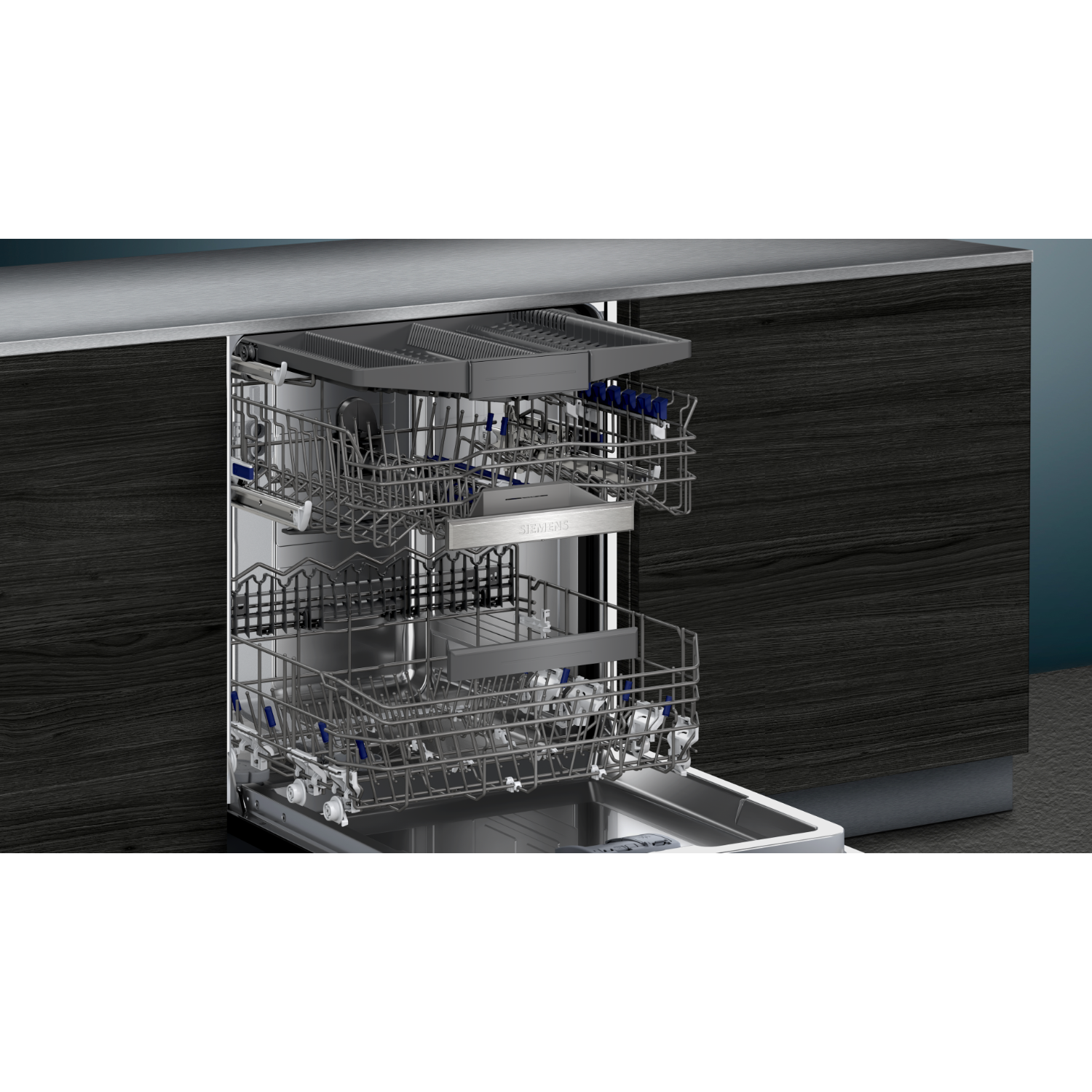 Dishwasher with open door, showing racks. Silver colored interior. Dark wood cabinets in the background.