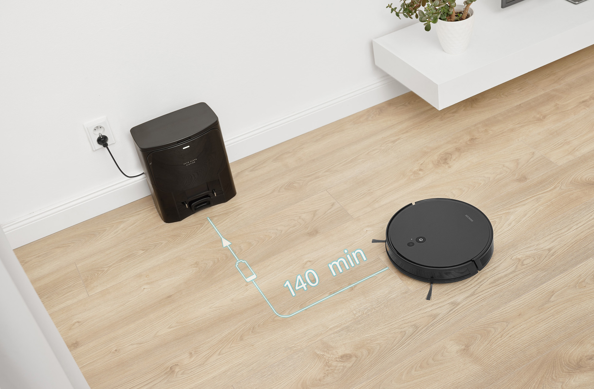 Robotporszívó és töltőállomás a parkettán. Egy kék vonal 140 percet mutat.
