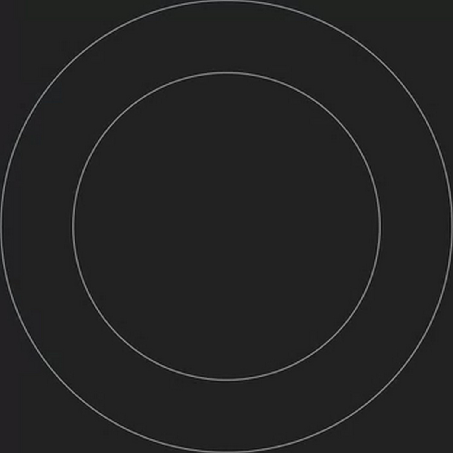 A black stove top with two concentric circles. The circles indicate a cooking zone or heating element.