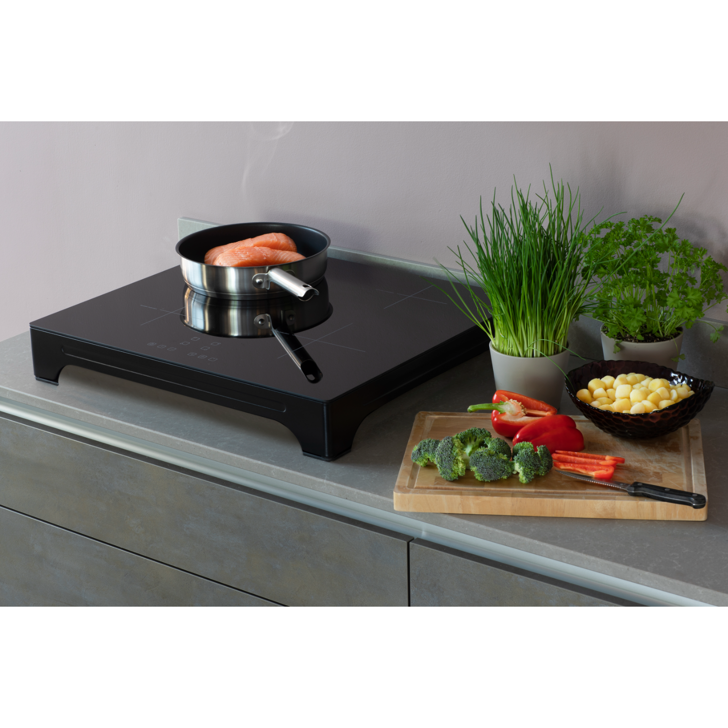 Food preparation scene. Salmon in a pan, vegetables on a cutting board, and other ingredients.