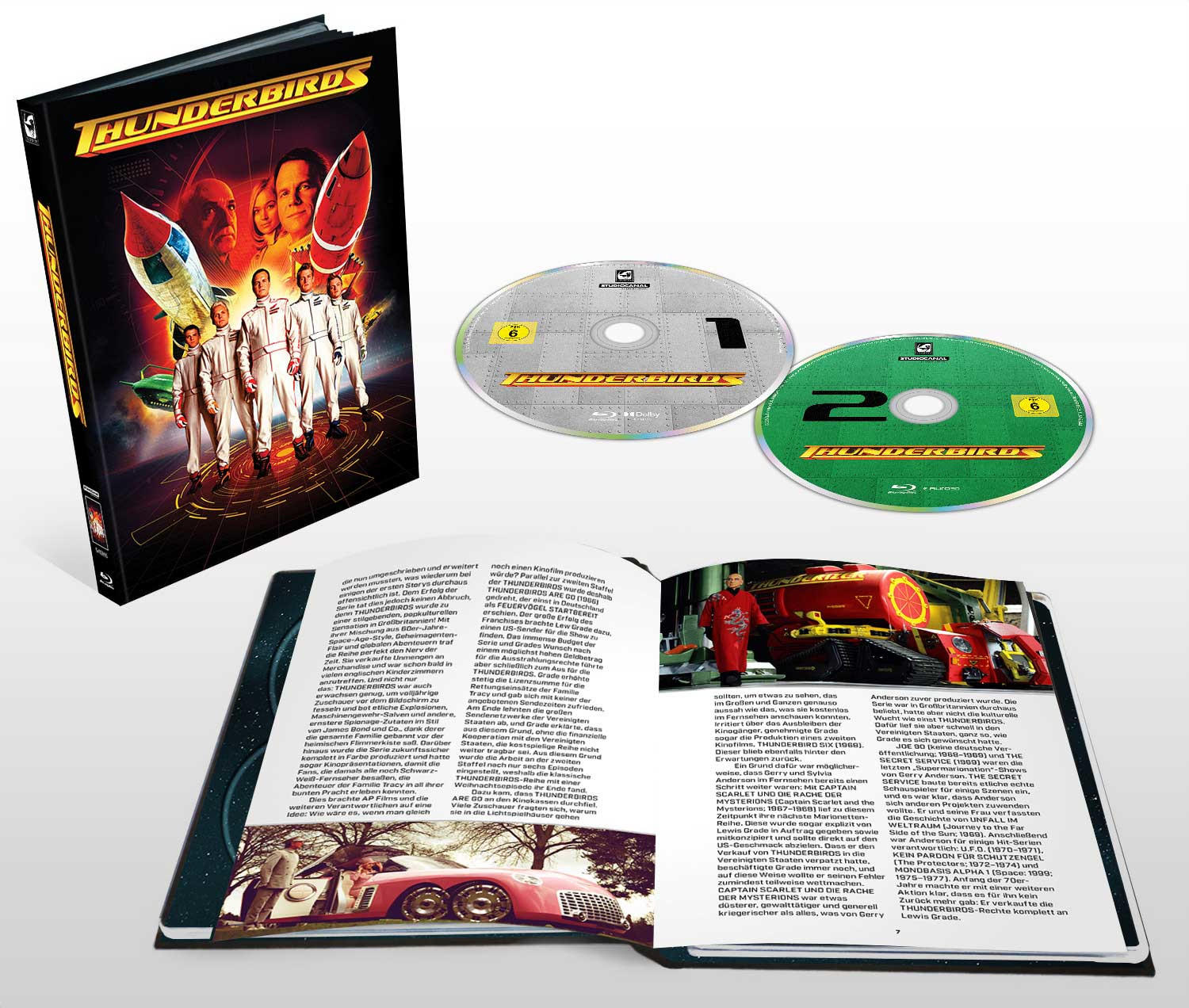 Eine DVD-Box mit Discs und ein Buch mit Text und Bildern.