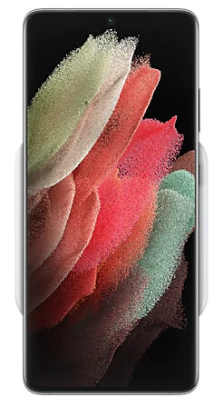 Smartfon na białej podkładce ładującej, z kolorowym abstrakcyjnym obrazem na ekranie.