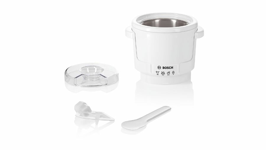 Biała maszyna do lodów z akcesoriami: pokrywką, łyżką i elementem mieszającym.