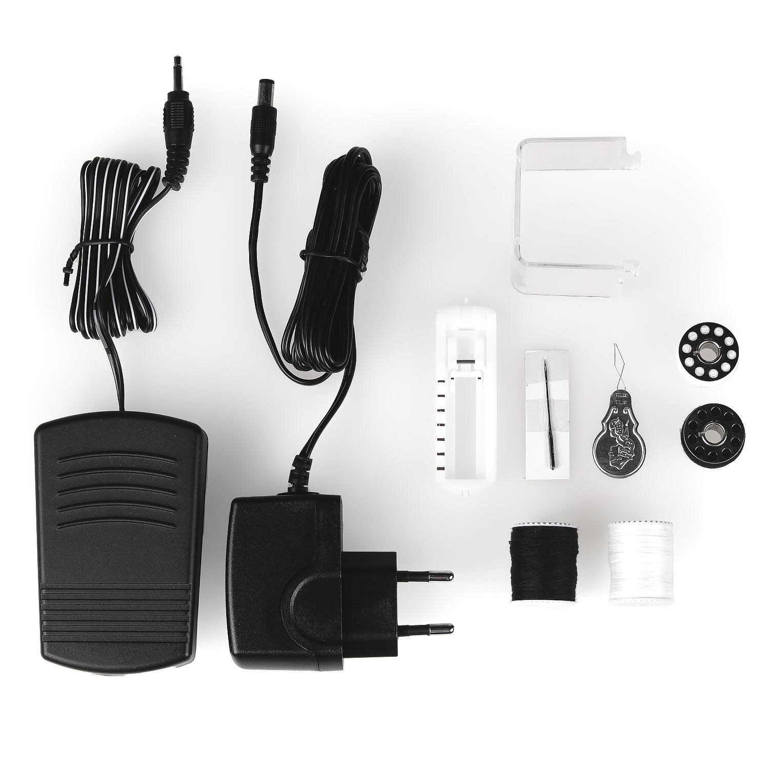 Akcesoria do maszyny do szycia na białej powierzchni.