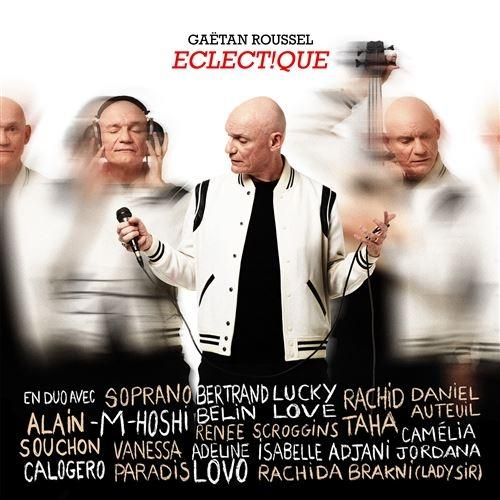 Pochette d'album avec Gaëtan Roussel et texte. Fond flou avec plusieurs figures.