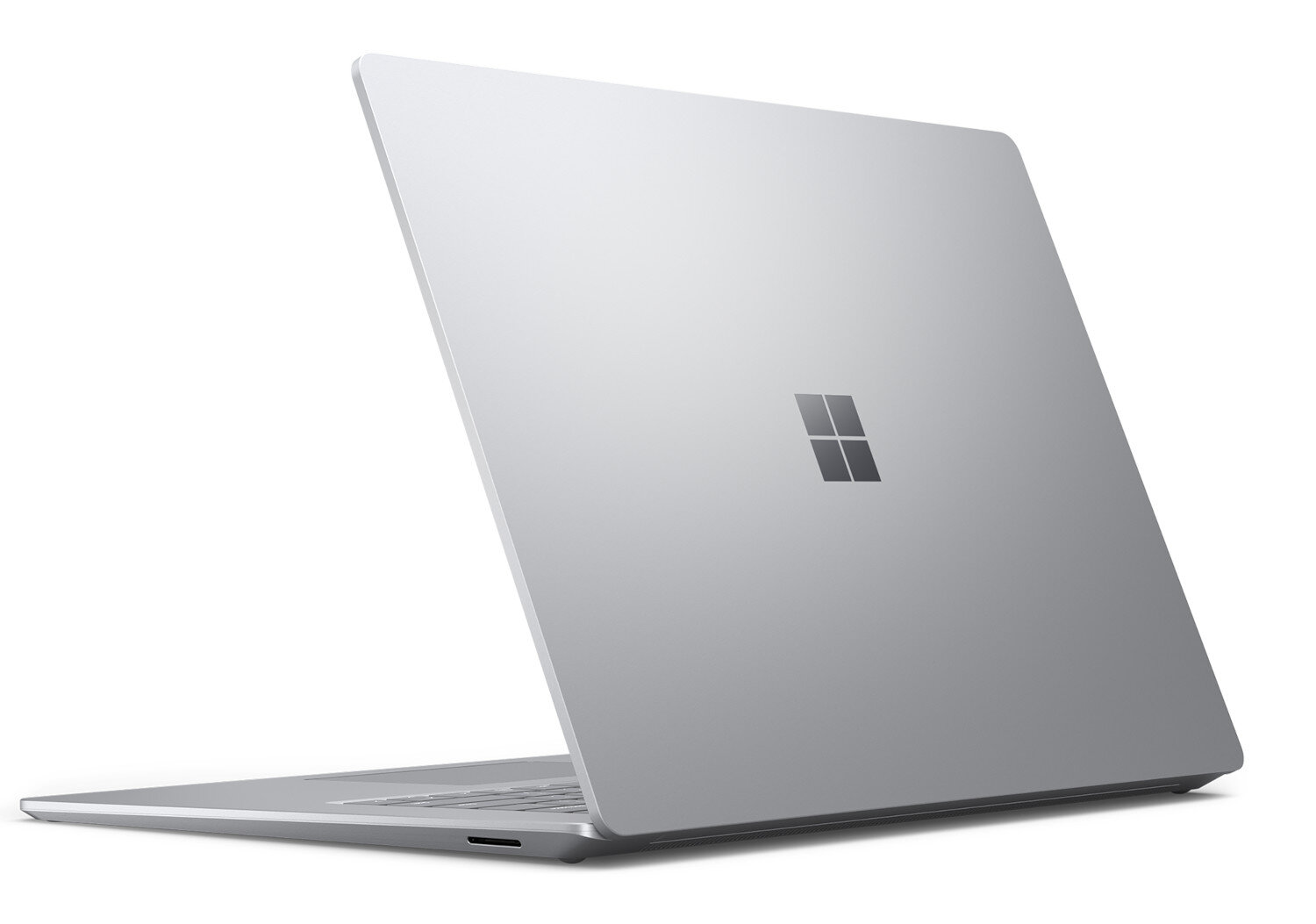 Srebrny laptop, widok z tyłu, z logo Microsoft.