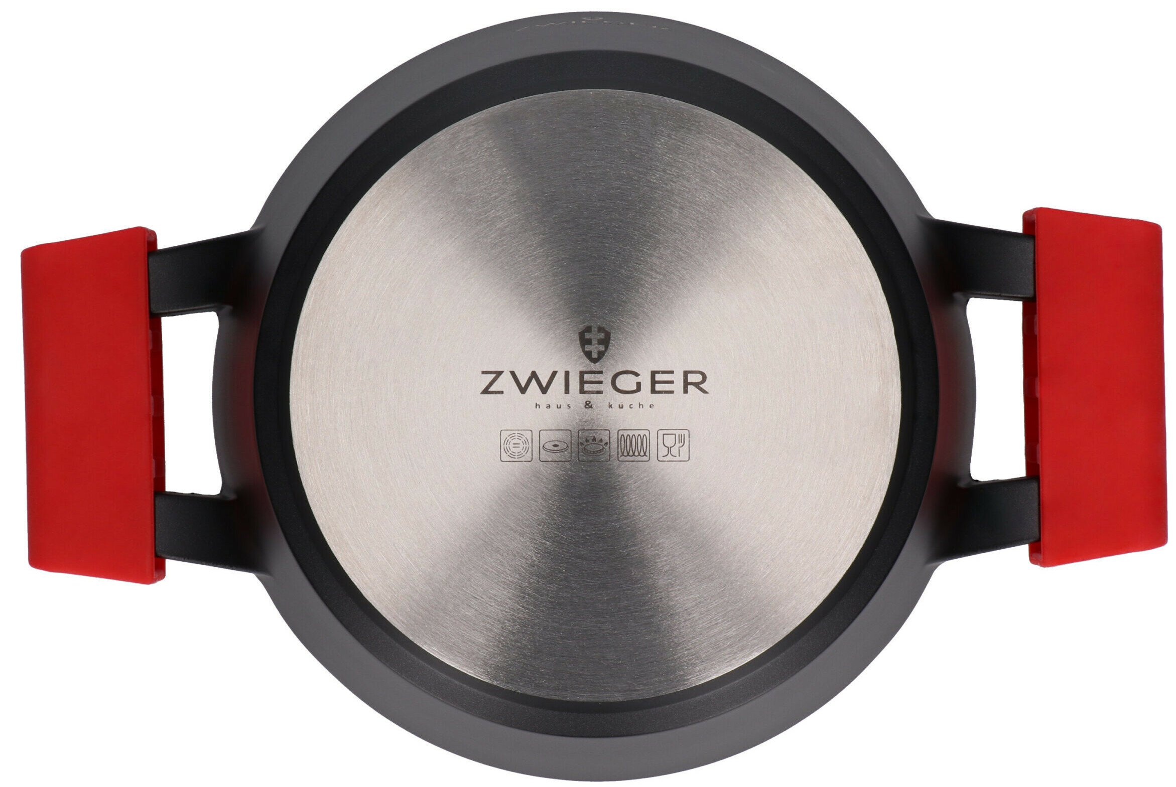 Okrągła podstawa garnka ze srebrnym wnętrzem, czarną obwódką i czerwonymi uchwytami. Widoczna marka.