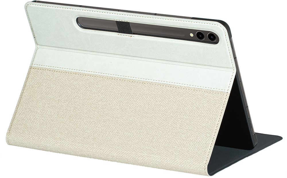 Tablet with white and beige cover standing on a surface.