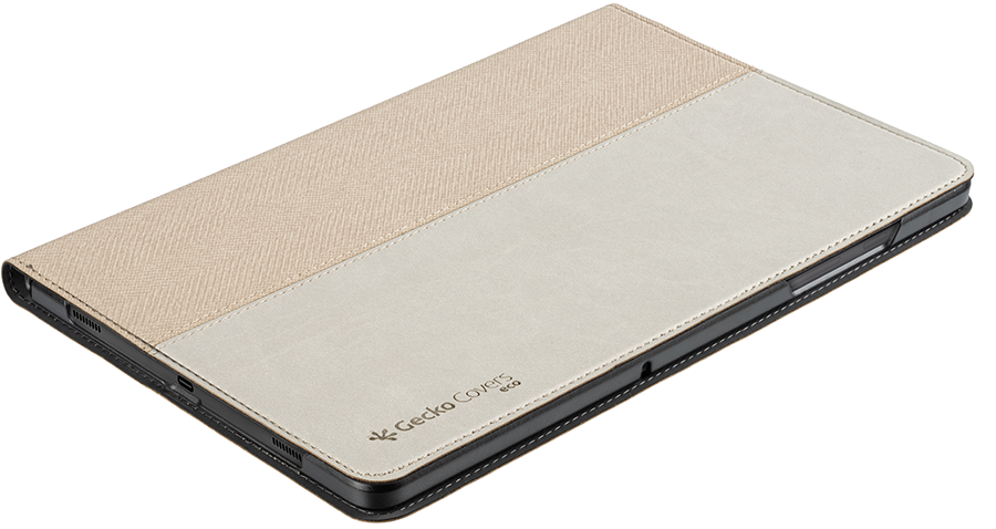 A tablet in a beige and white case, lying on a surface, angled view.