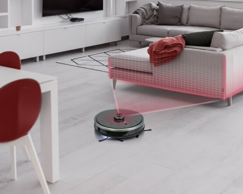 Robot sprzątający odkurza salon. Pokazuje czerwoną siatkę mapującą obszar.