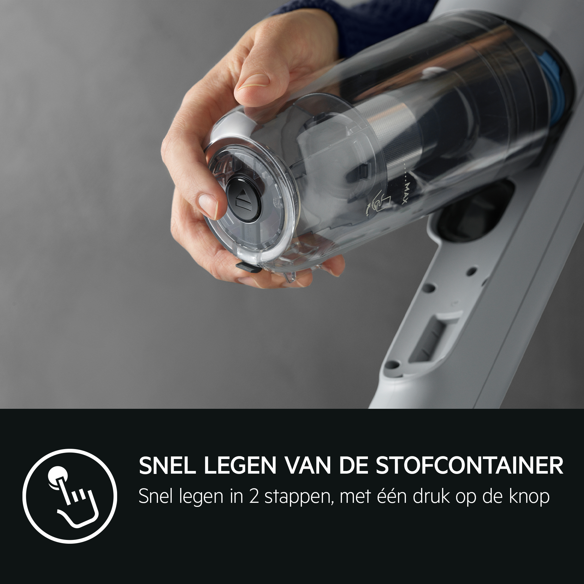 A person is emptying the dust container of a vacuum cleaner. Gray background. Dutch text.