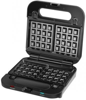 Otwarta czarna gofrownica pokazująca formy do gofrów.