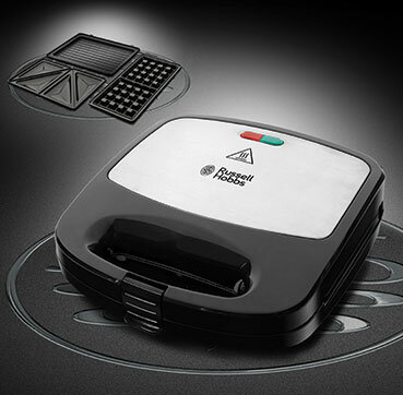 Czarna i srebrna gofrownica Russell Hobbs. Dodatkowe płyty są z boku.