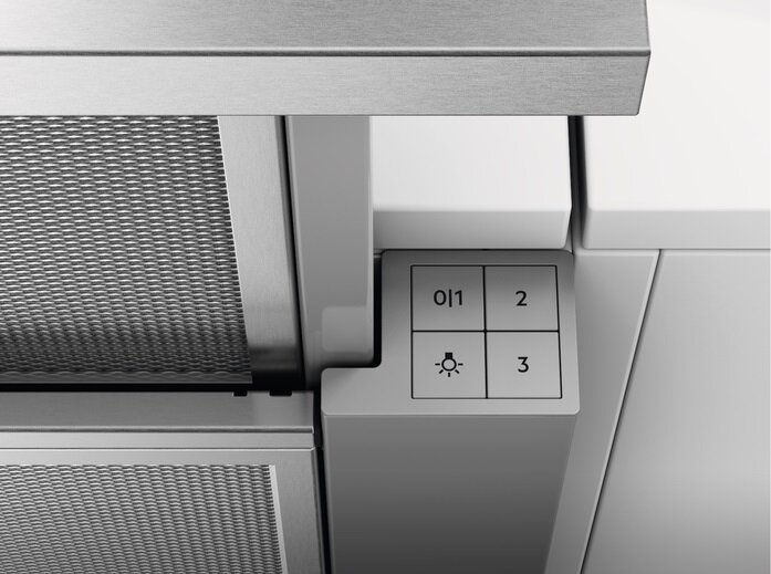 Zbliżenie urządzenia kuchennego. Panel z przyciskami i fragment filtra urządzenia.