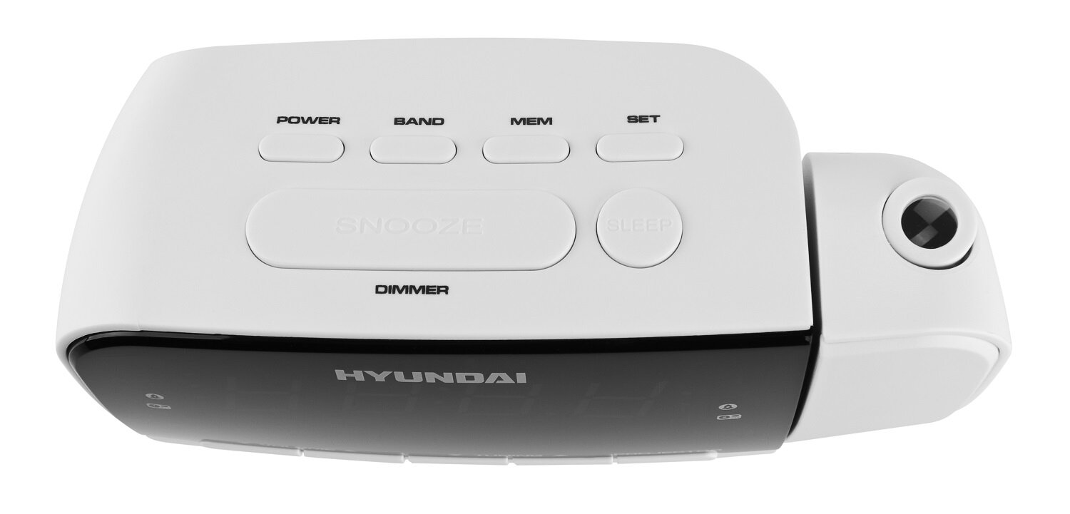 Biało-czarny budzik z przyciskami i wyświetlaczem. Pokazuje godzinę.