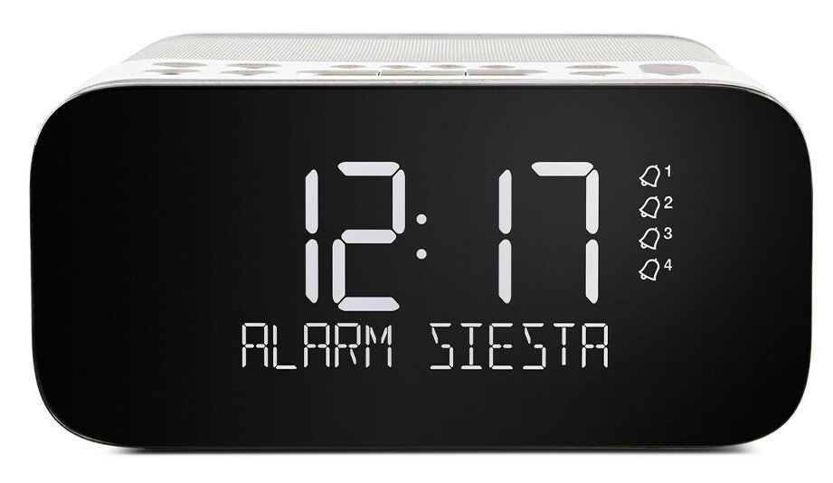 Cyfrowy budzik z wyświetlaczem '12:17' i 'ALARM SIESTA'. Białe cyfry na czarnym tle.