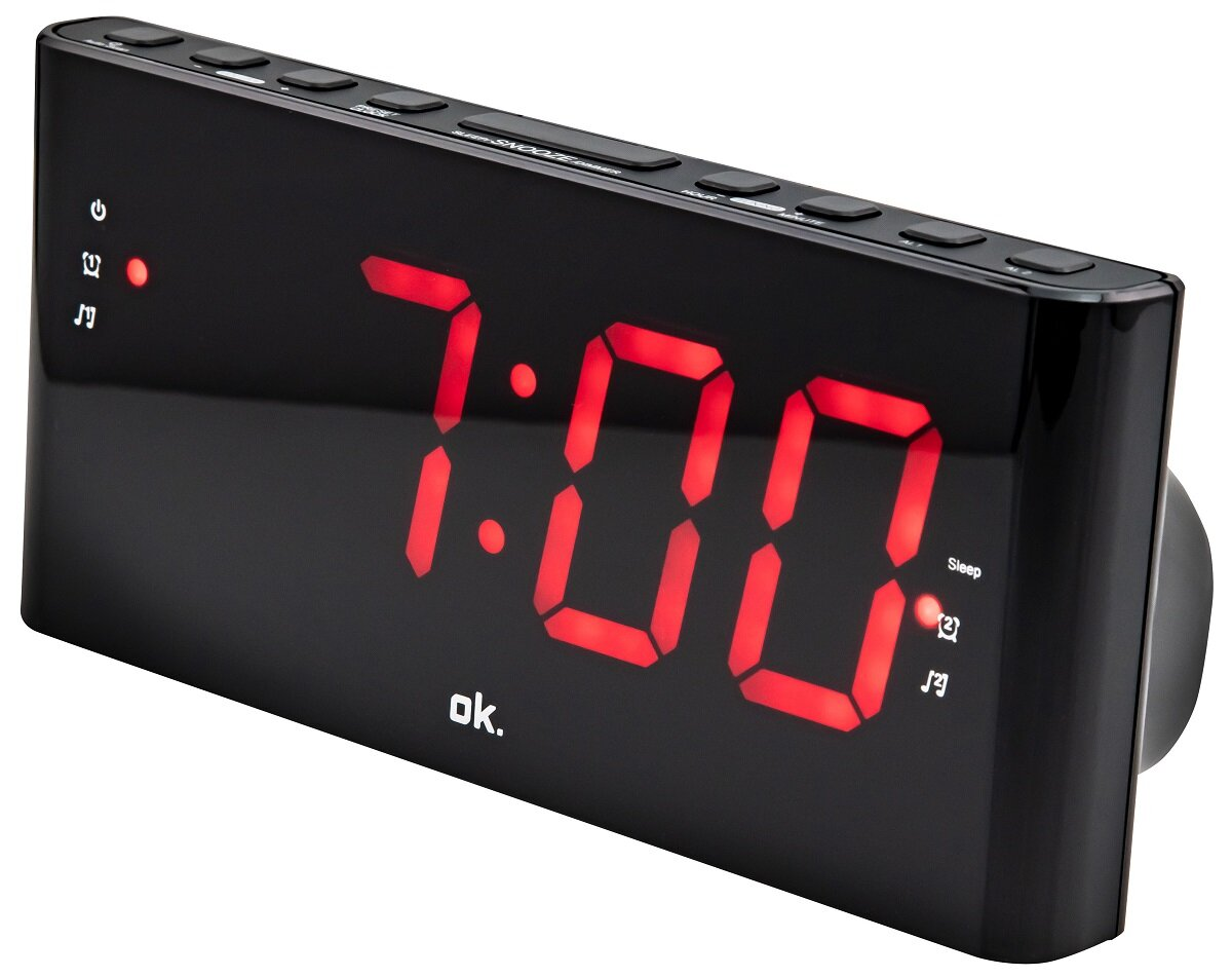 Czarny budzik cyfrowy z 7:00 w czerwonych cyfrach. Przyciski na górze, funkcja sleep.