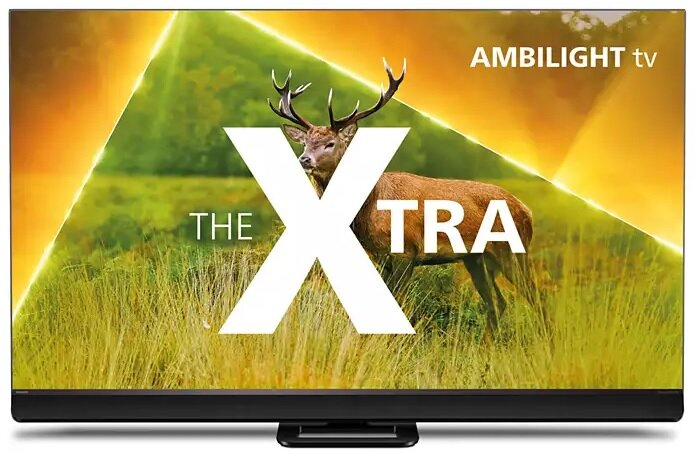 Ekran telewizora pokazuje łosia na polu. Tekst: The Xtra. Logo Ambilight TV w prawym górnym rogu.