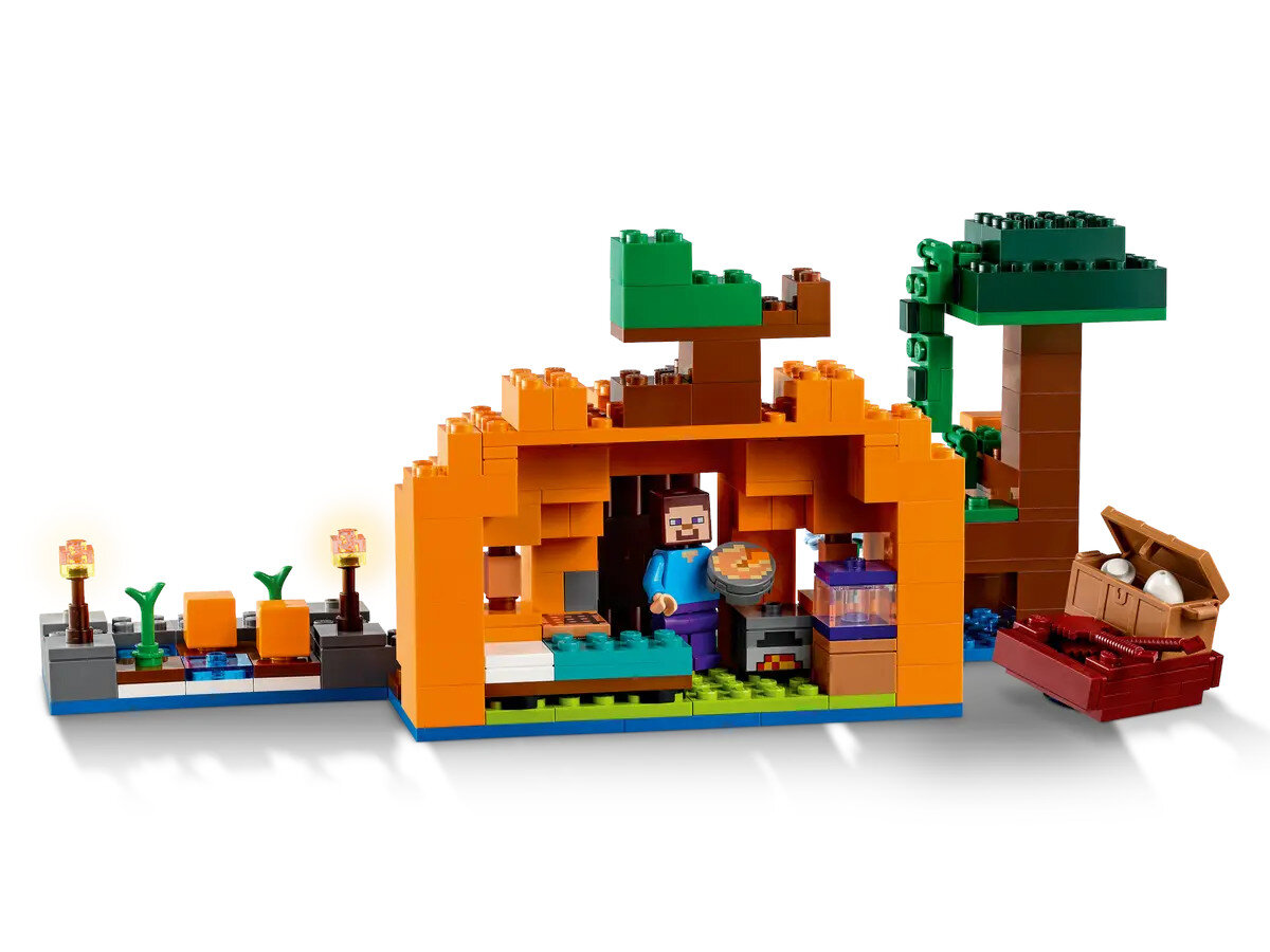 Scena Lego Minecraft z postacią w budynku.