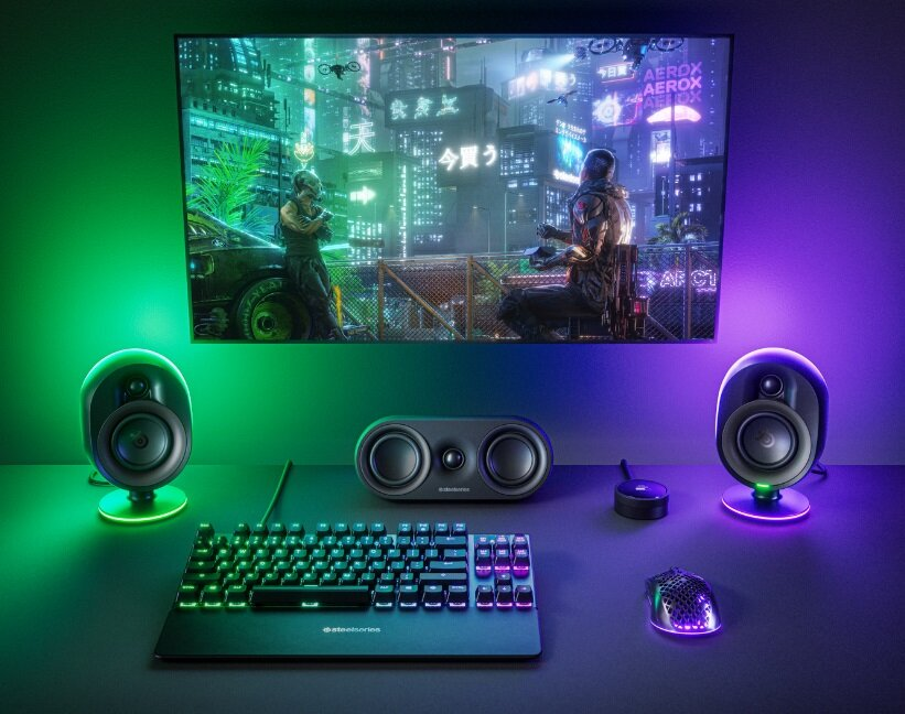 Konfiguracja do gier z monitorem, głośnikami, klawiaturą, myszą i światłami LED.
