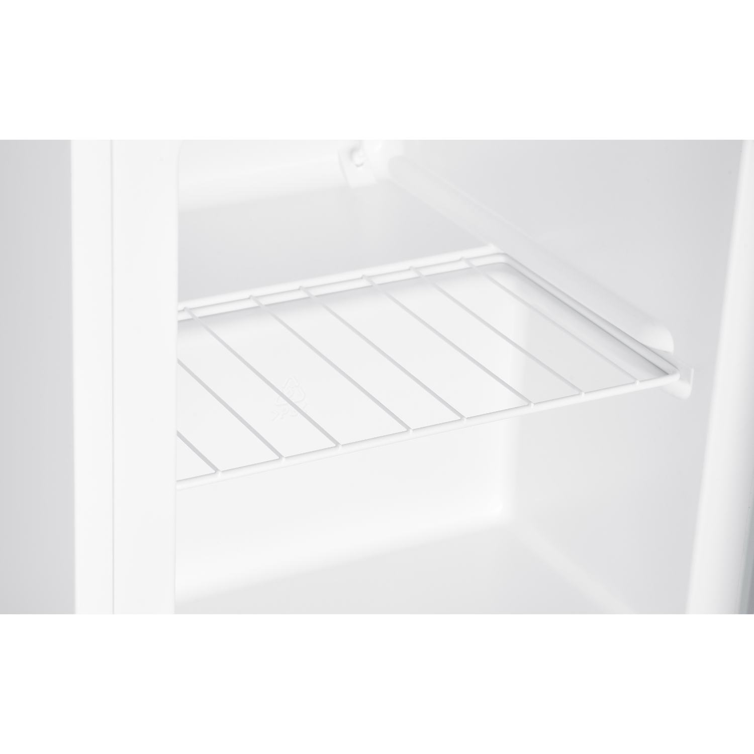 Inside a white refrigerator with one wire shelf. The shelf is empty and there is white space.