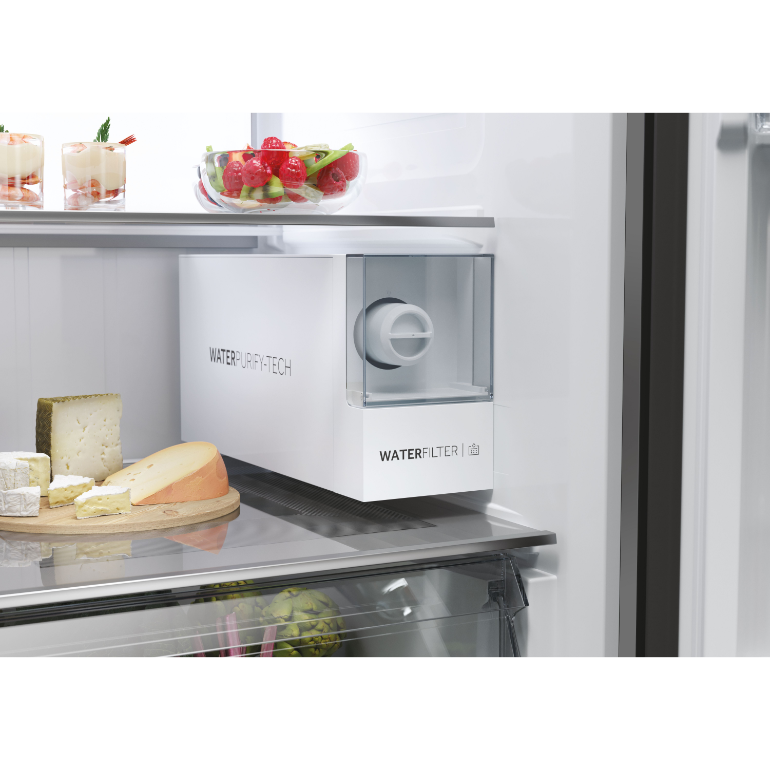 Open refrigerator with cheese, fruit, and water filter.