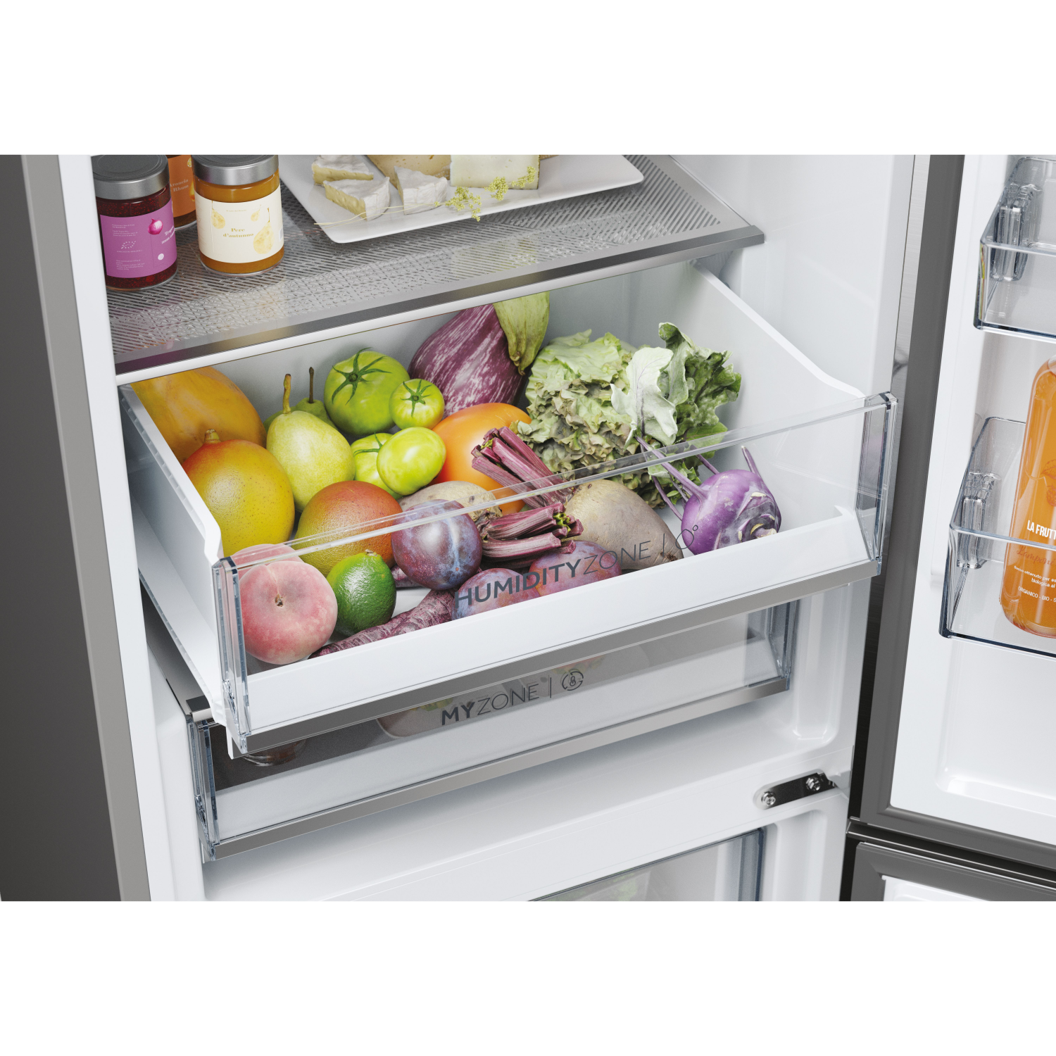 Refrigerator interior with fresh produce in a drawer labeled 'Humidity Zone'.