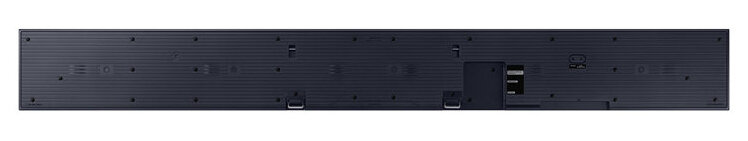 Czarny soundbar z otworami i złączami. Prostokątny kształt, białe tło.