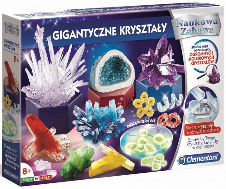 Pudełko z zestawem do hodowli kryształów, różne kryształy w różnych kolorach, w tym fioletowy, czerwony i niebieski.