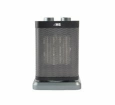 Mały czarno-szary grzejnik elektryczny na białym tle. Ma siatkowy przód.