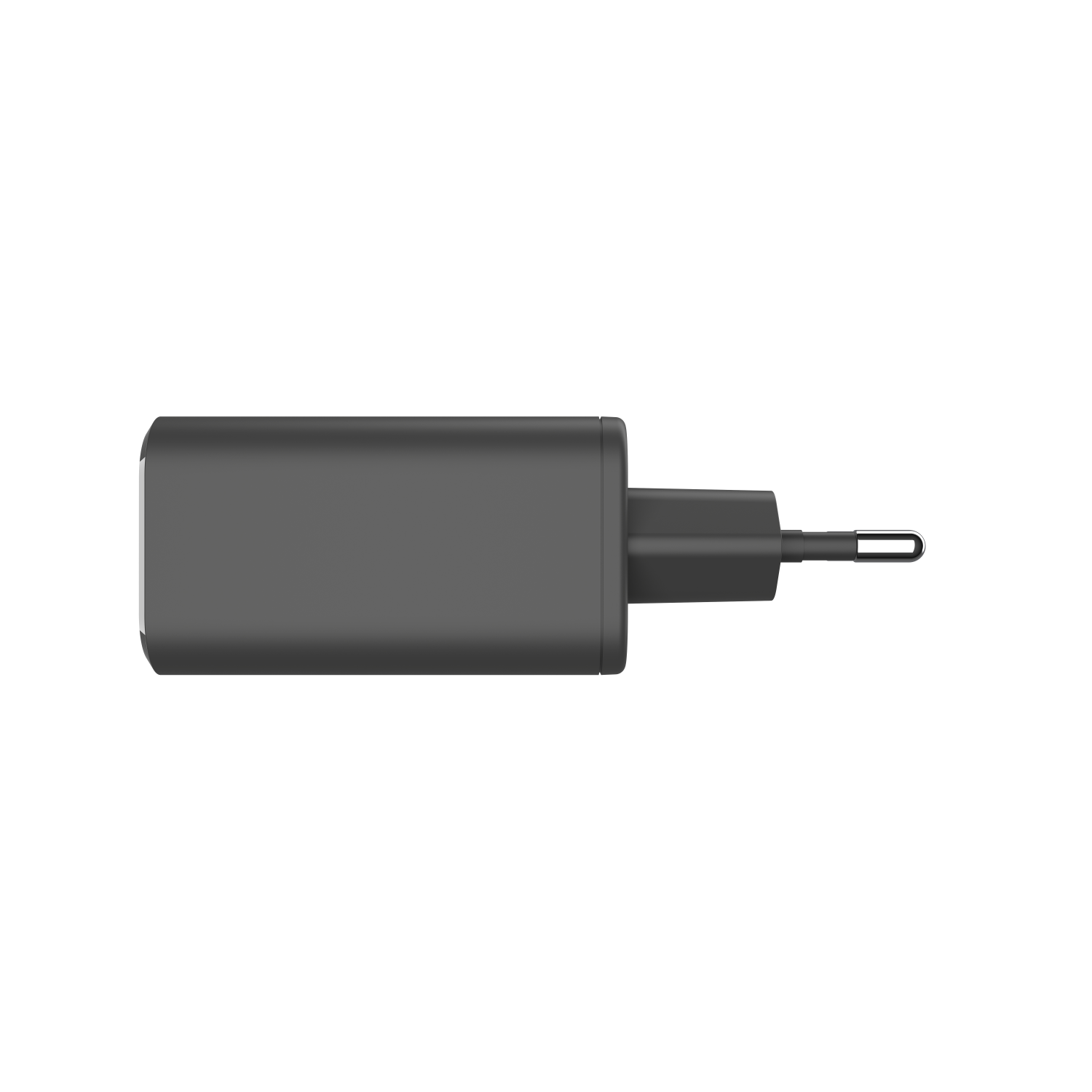 A dark grey power adapter with a single prong, viewed from above against a black backdrop.