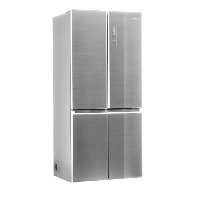 Srebrna lodówka z czterema drzwiami, białe tło. Widoczne logo Haier.