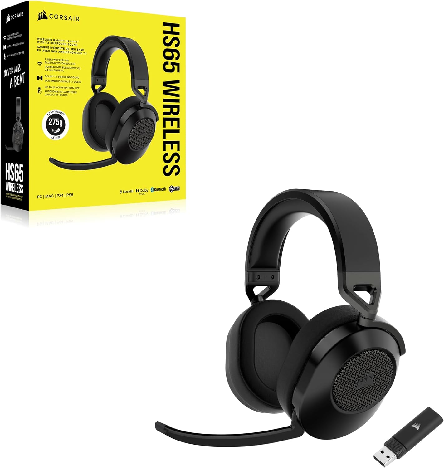 Auriculares inalámbricos negros. Caja en el fondo. Los auriculares están sobre una superficie blanca.