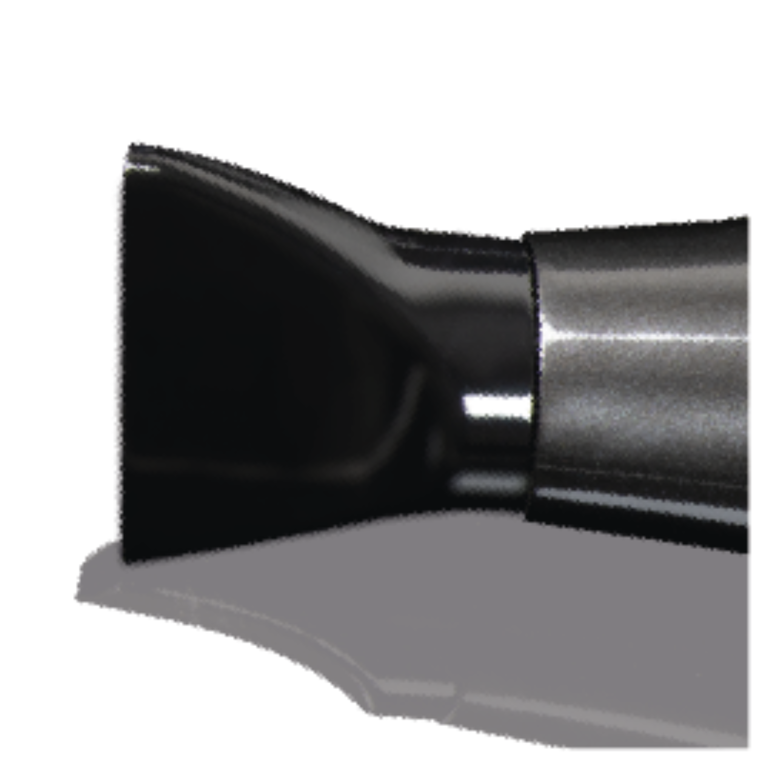 A close-up view of the nozzle of a black hairdryer on a grey surface.