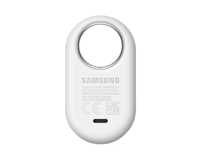 Dispositivo Samsung blanco, forma ovalada con agujero, marca y detalles técnicos.
