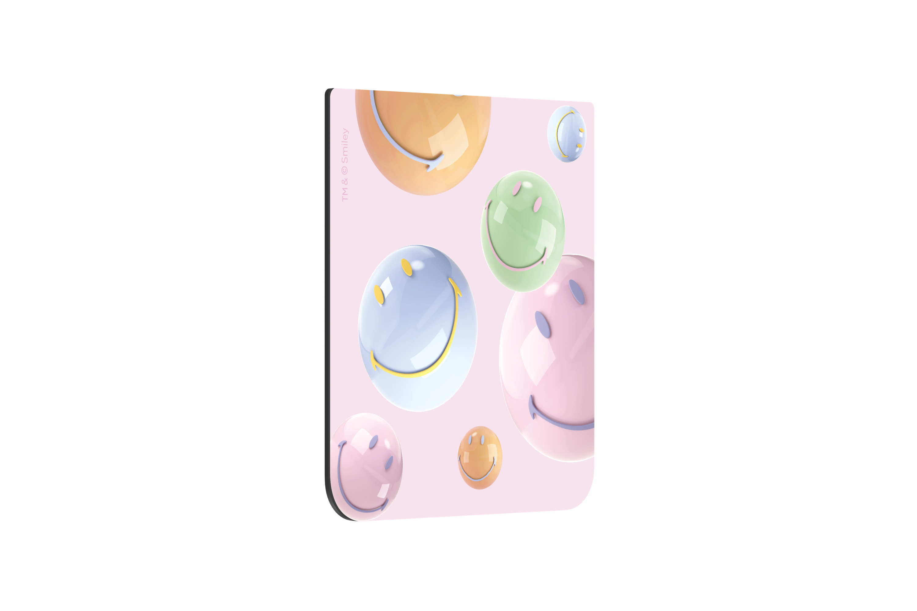 Alfombrilla rosa con bolas de caras sonrientes.