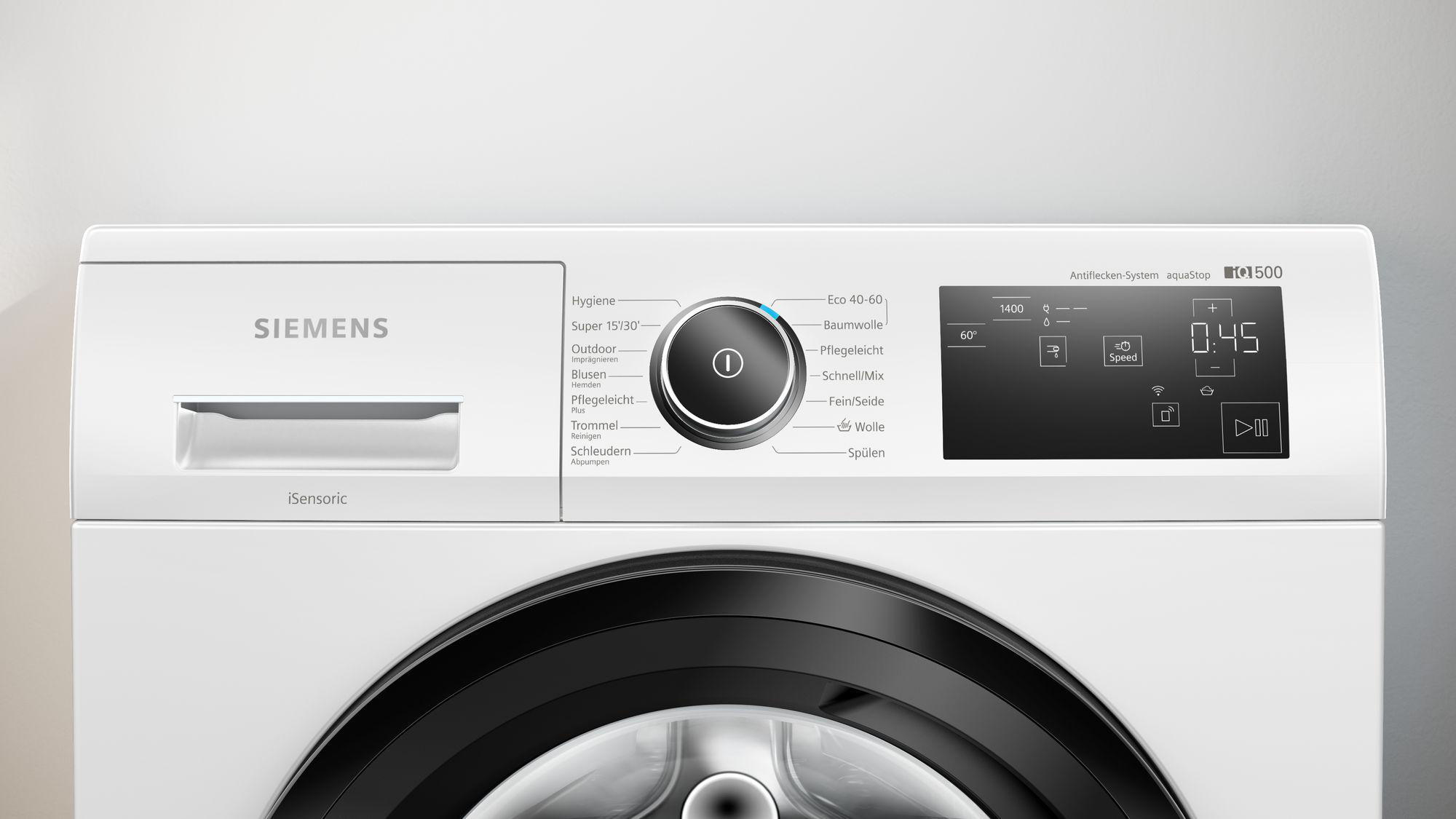 Die Oberseite einer weißen Siemens Waschmaschine, mit einem Drehregler und einem Digitaldisplay.