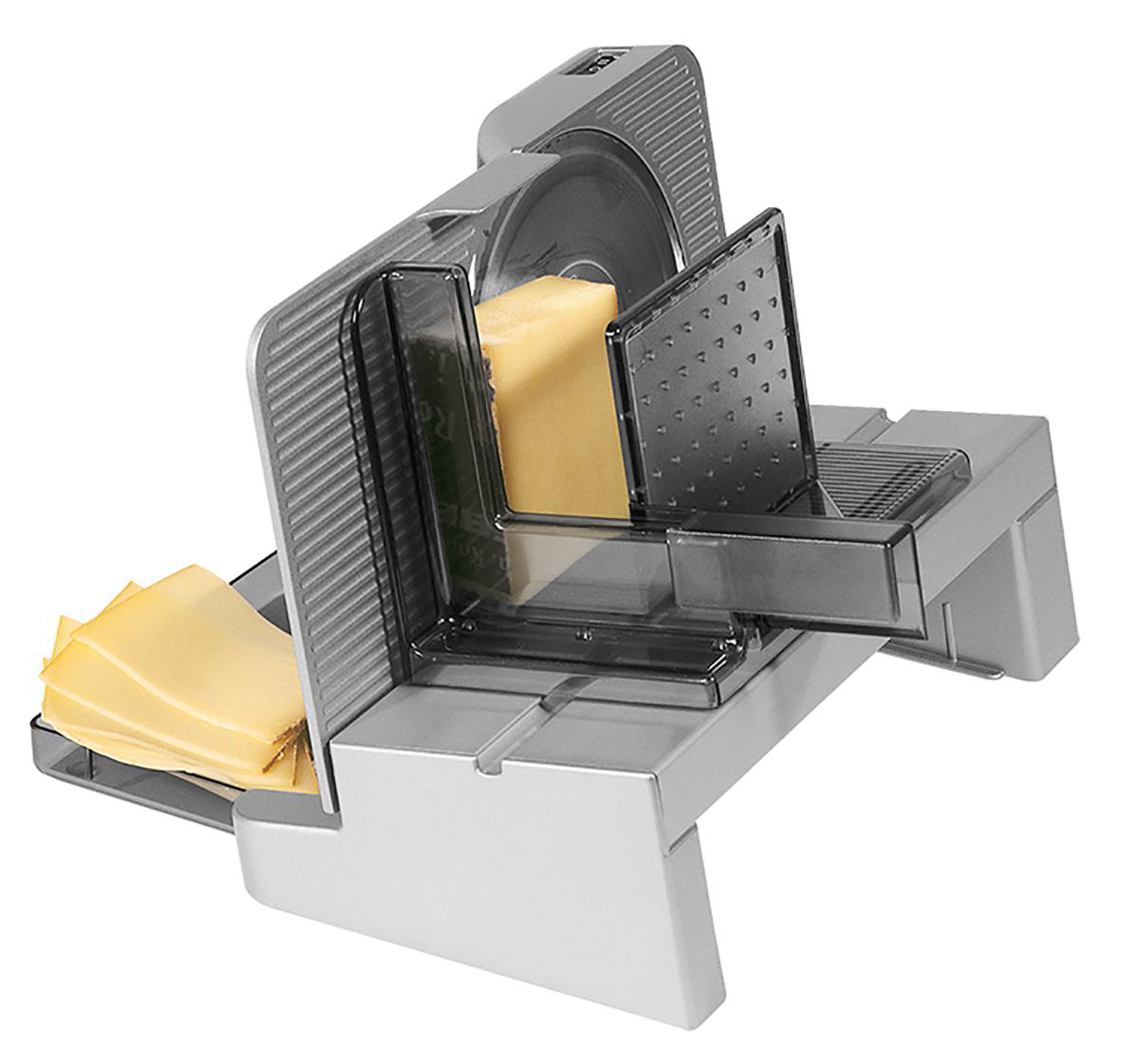 Silberner Käseschneider mit Käseblock und geschnittenem Käse sichtbar.