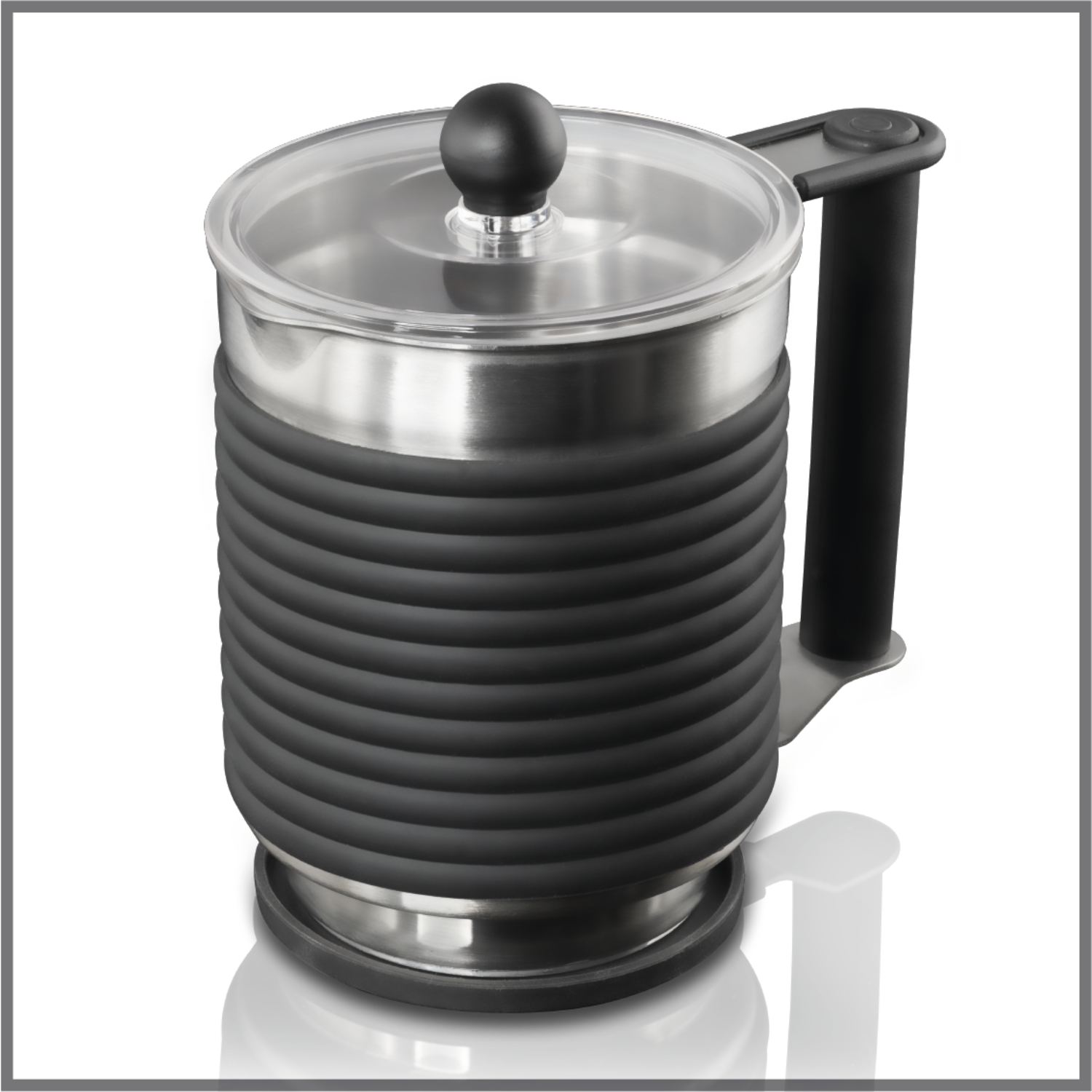 Silver and black milk frother. Clear lid, black handle, white background.