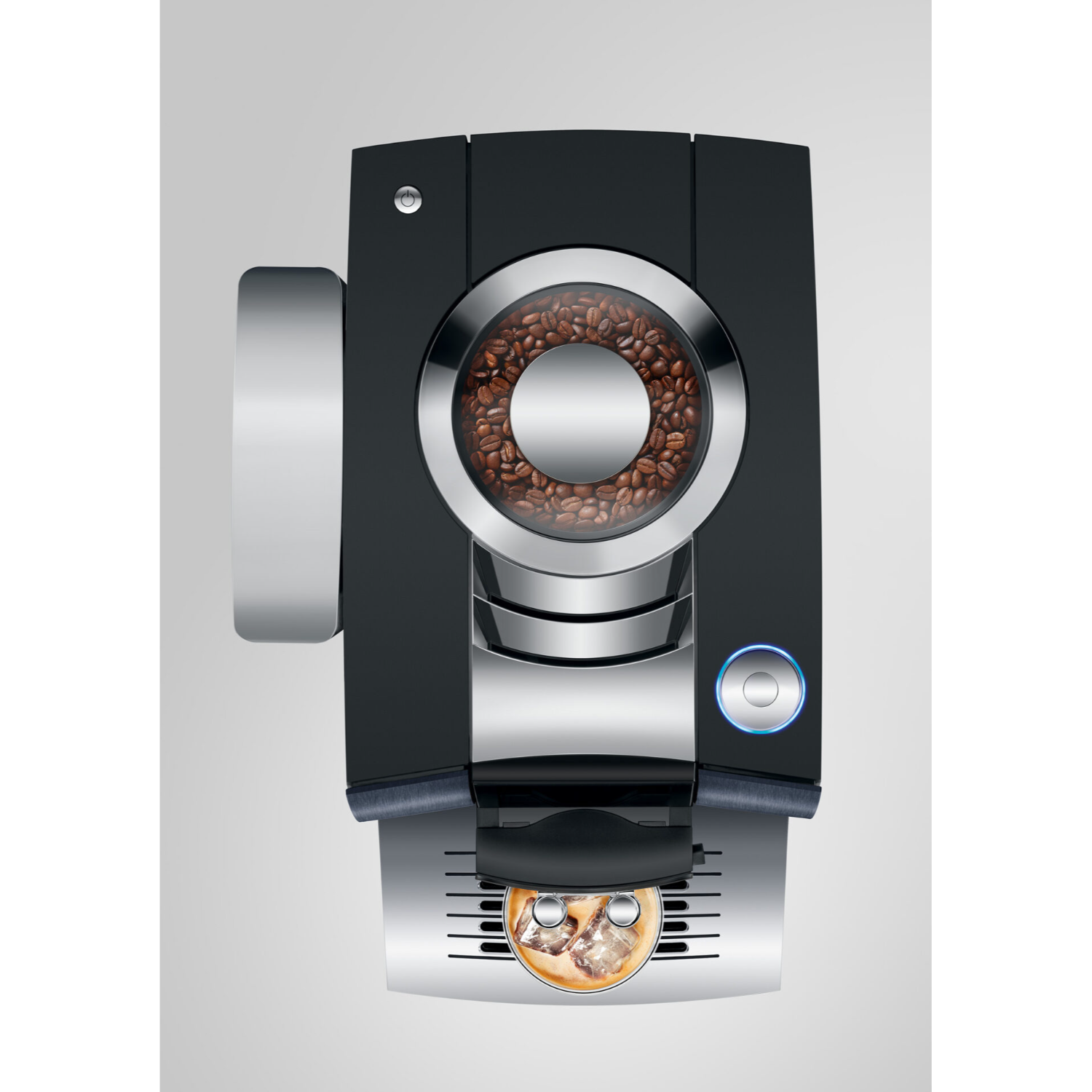 Top view of a black coffee machine with coffee beans visible, and a cup of coffee ready.