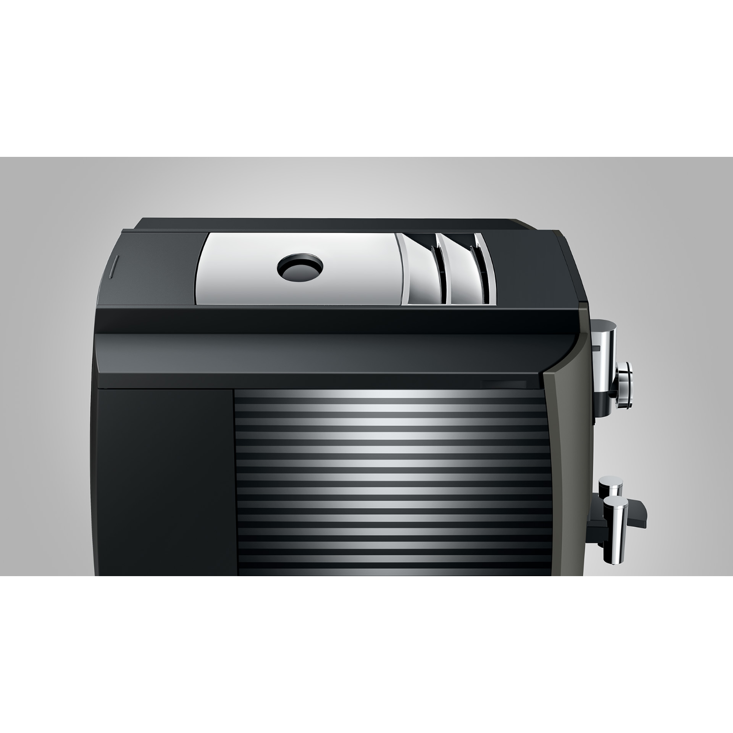Black and grey coffee machine. Silver accents, sleek design, with a top water tank and coffee outlets.