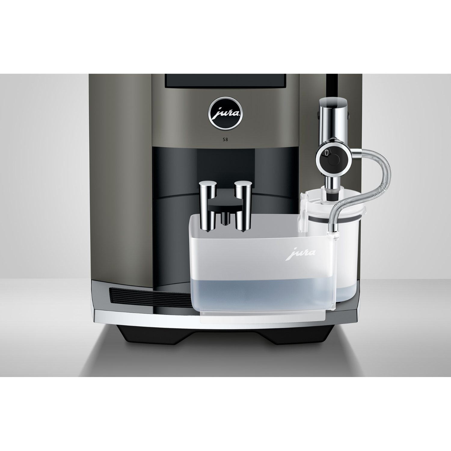 Close up of a Jura S8 coffee machine. Water tank and spout visible, grey and black color scheme.
