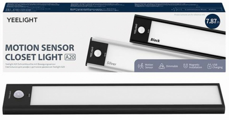 Czarne światło ze srebrnym akcentem i pudełkiem z tekstem. Białe tło.