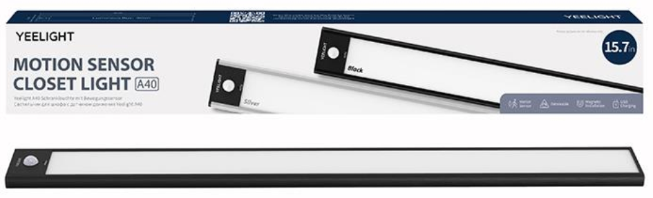 Biało-czarne oświetlenie szafy z czujnikiem ruchu. Widoczne pudełko i pasek świetlny.