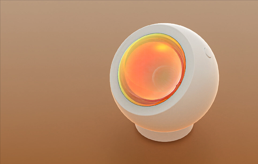 Białe i pomarańczowe futurystyczne urządzenie z okrągłym, świecącym środkiem, na brązowej powierzchni.