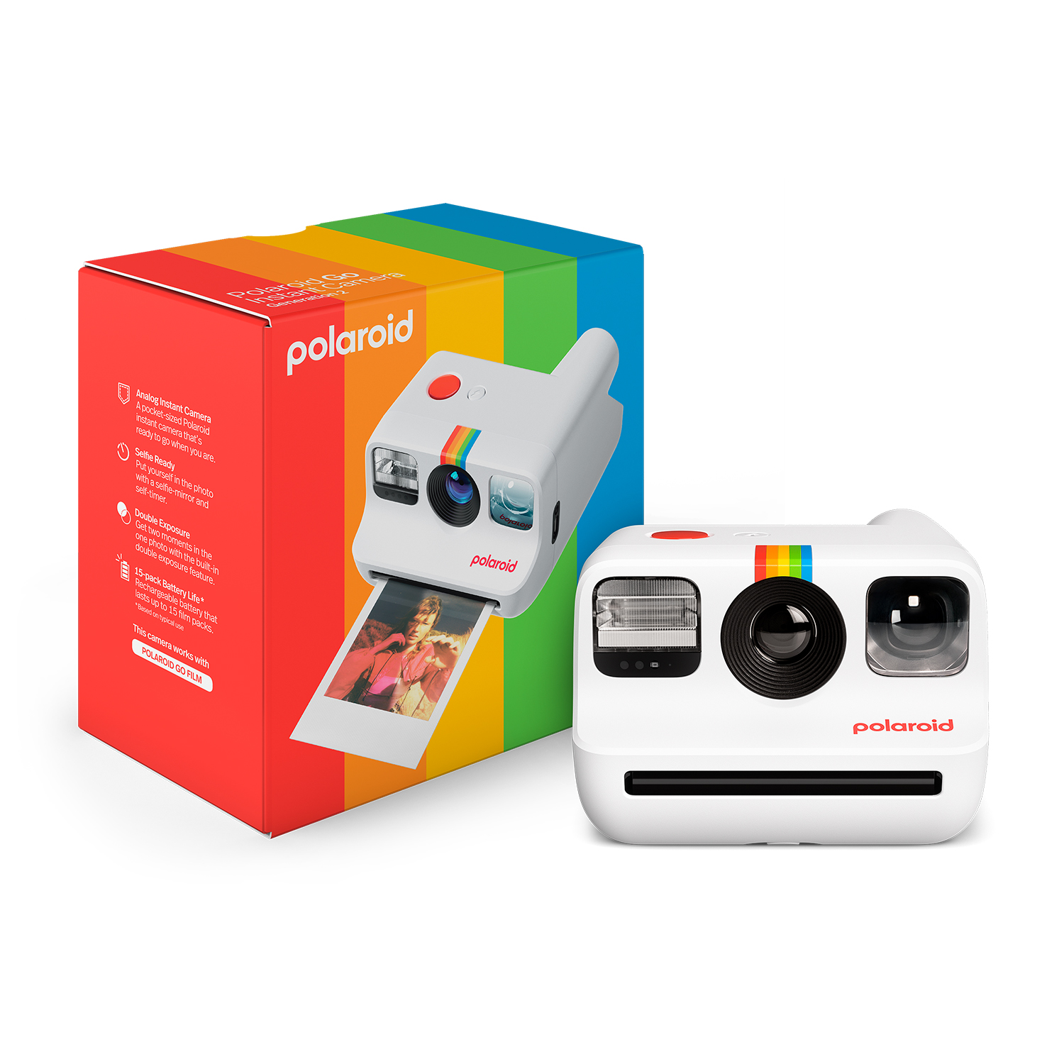Fotocamera Polaroid bianca con striscia arcobaleno, accanto a una scatola con colori arcobaleno.