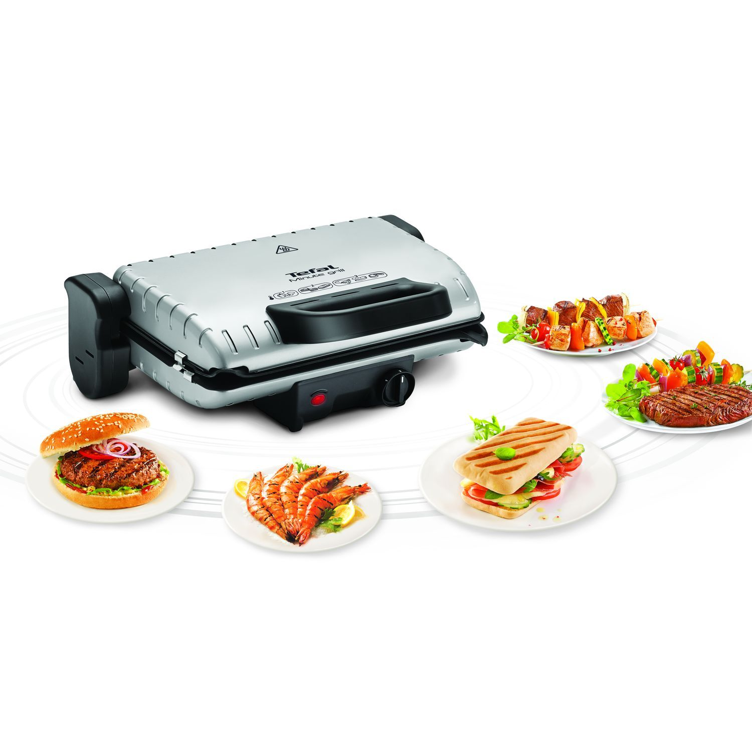 A grill with various cooked food plates.