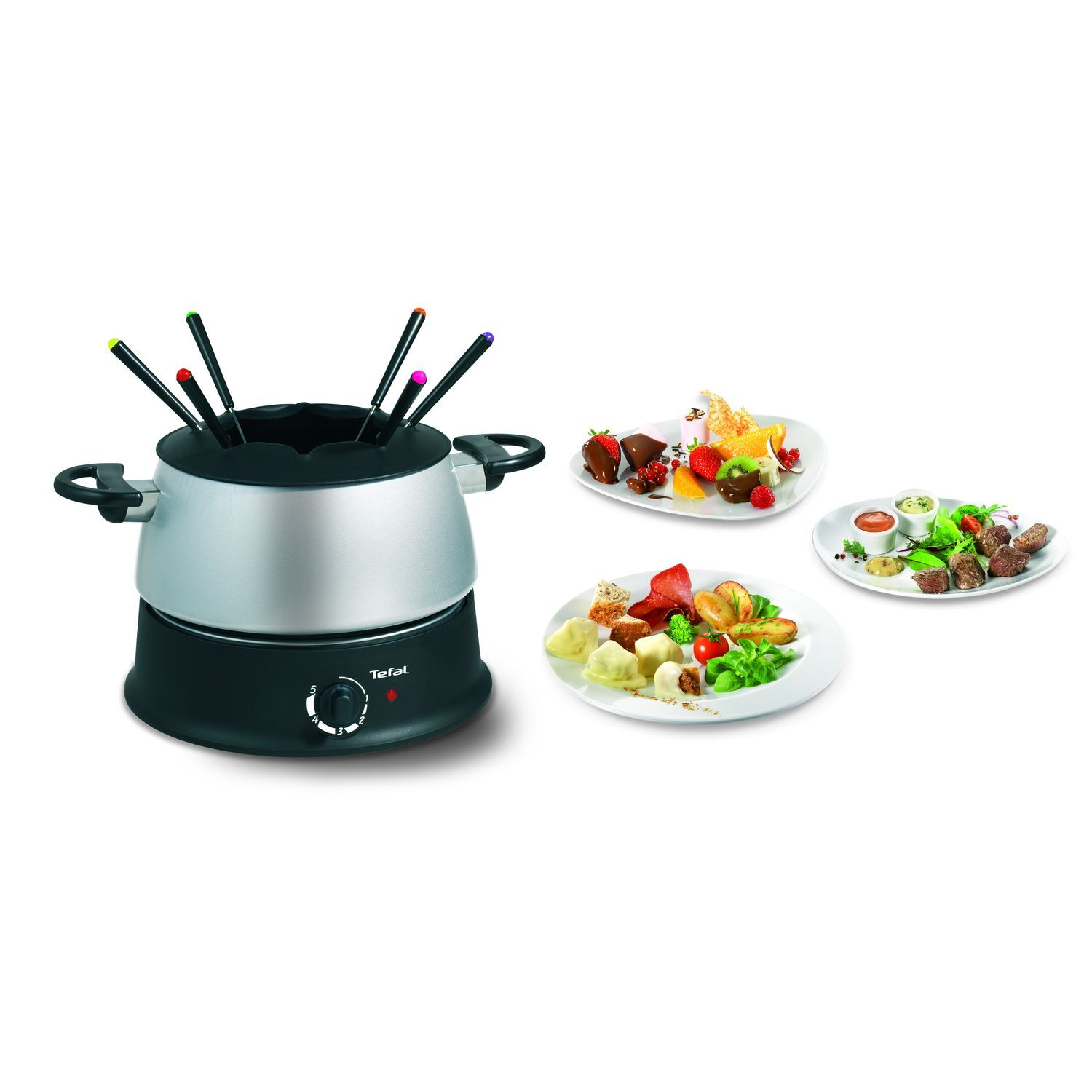 Ensemble à fondue Tefal avec nourriture. Comprend un caquelon, des fourchettes et des assiettes avec divers aliments.