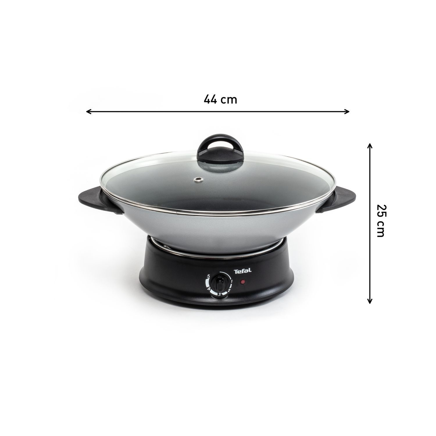 A black Tefal wok on a black base. It has a glass lid and is next to a white background.