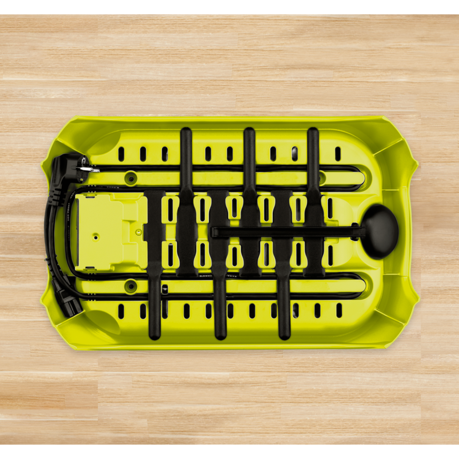 Lime-green power strip, with black cords and plugs, on a light wood surface.